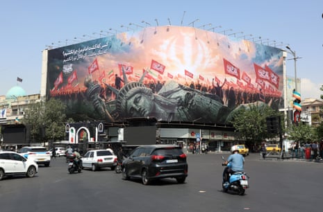 A billboard in Tehran showing a toppled statue of liberty.