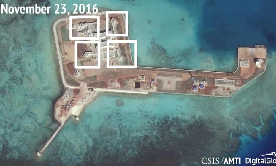 A satellite image shows what the Asia Maritime Transparency Initiative says appears to be anti-aircraft guns and close-in weapons systems (CIWS) on the artificial island Hughes Reef in the South China Sea.