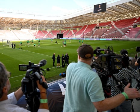 Cameras film the Republic of Ireland squad training inside a mostly empty stadium