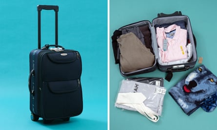 A blue suitcase full of clothes.