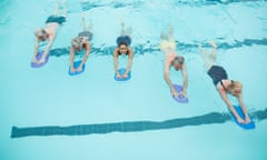 Swimmers with trainer in a pool