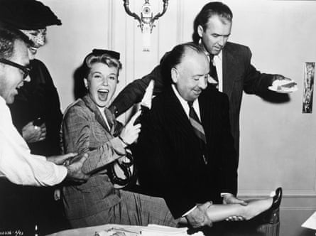 Doris Day with Alfred Hitchcock, second from right, and James Stewart, right, on the set of The Man who Knew Too Much in 1956.