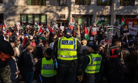 Protesters take part in the pro-Palestine march in London.