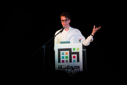 a man speaks into a microphone