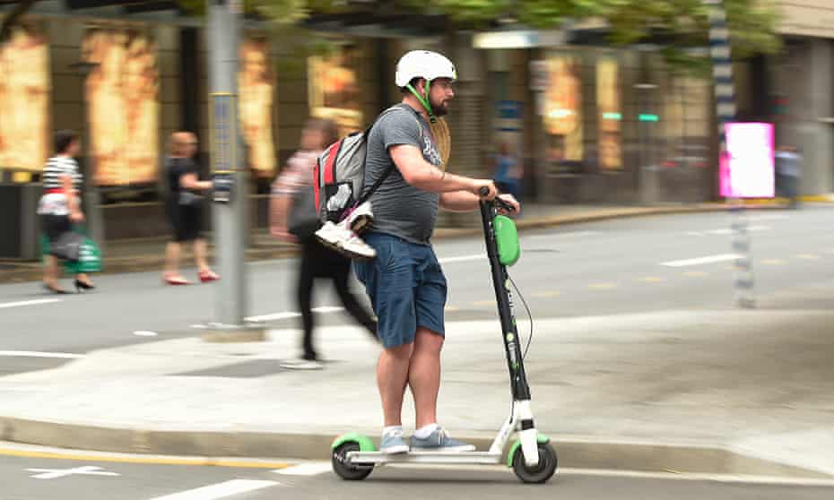 A man rides an e-scooter in Brisbane’s CBD. Queensland is the only state or territory in Australia where an electric scooter above 200 watts can be ridden on footpaths.