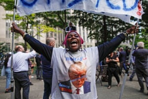 A woman cheers outside the courthouse after former US president Donald Trump was convicted.