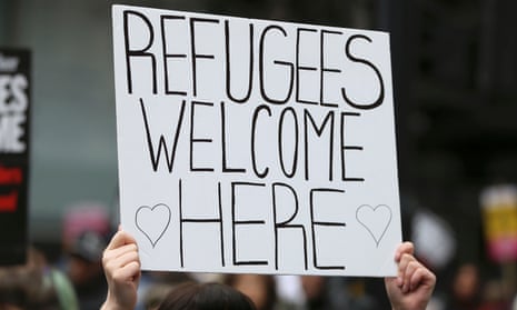Woman holds a 'refugees welcome sign' in London, March 2016