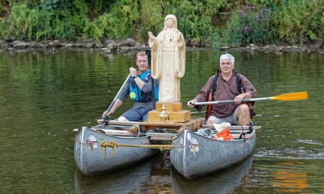 Philip Chatfield, right, with his statue Our Lady of the Waters and the Wye and local canoeist Callum Bulmer.