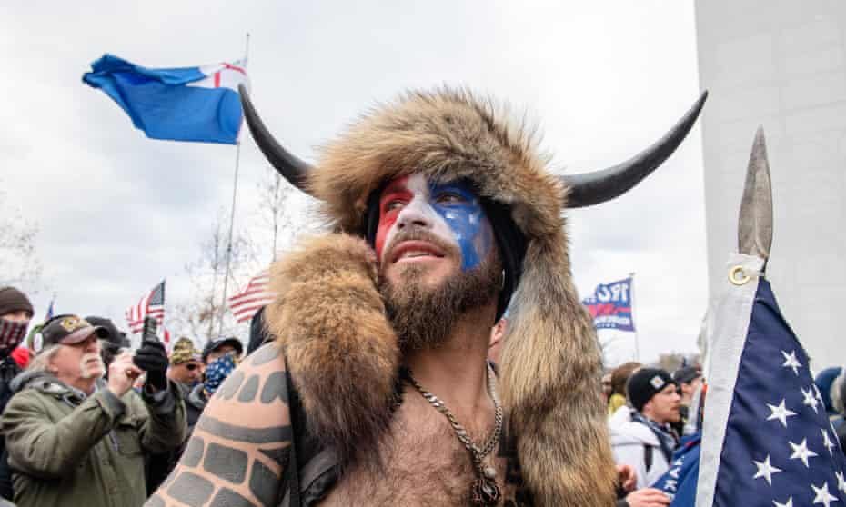 Jake Angeli is seen as Trump supporters protest outside of the Capitol Building on January 6 2021 in Washington DC.