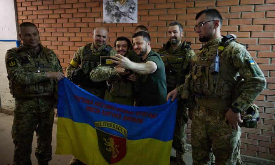 Zelenskiy taking a selfie with Ukrainian servicemen during his visit to the frontline positions of the army in Bakhmut and Lysychansk districts