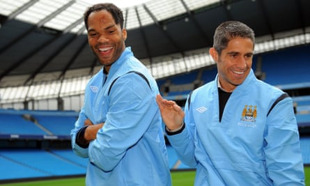 Sylvinho and his fellow new Manchester City signing Joleon Lescott in August 2009.