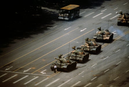 A lone protester blocks the path of a column of tanks leaving Tiananmen Square on 5 June 1989