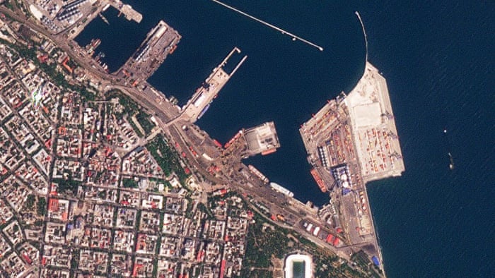 This satellite photo from Sunday shows the Sierra Leone-flagged cargo ship Razoni, center with white masts, docked at the port in Odesa.