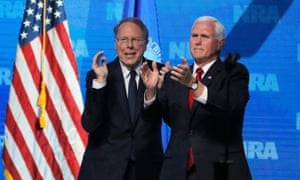 Mike Pence and Wayne LaPierre applaud Trump’s speech.