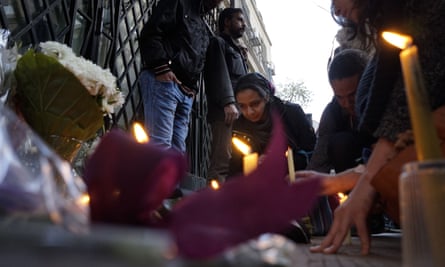 Mourners light candles and lay wreaths in memory of Giulio Regeni in front of the Italian embassy in Cairo.