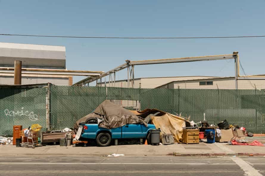 A car encampment on a sidewalk in an industrial area in Oakland, California, 31 July 2019.