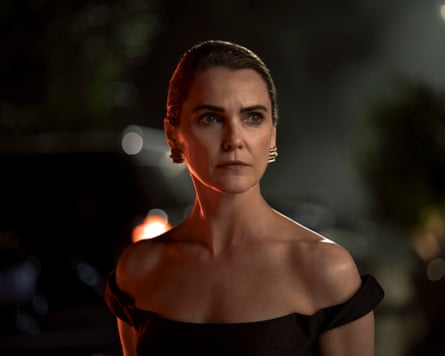 Keri Russell as Kate Wyler in an off-shoulder black gown