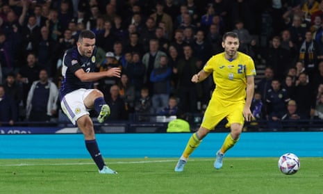 Scotland’s John McGinn fires home to give the home side a deserved lead.