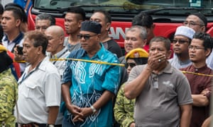 People gather near the scene of the blaze