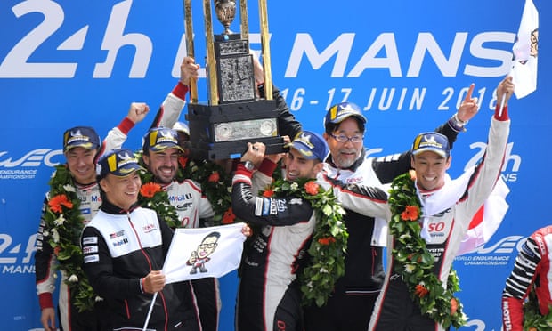 The Toyota team including Fernando Alonso celebrate after winning the 86th edition of the Le Mans 24 Hours race.