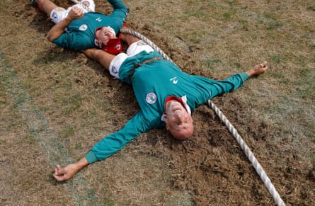 José Antonio Goirigolzarri of the Basque Country team collapses on the rope as he celebrates winning the deciding leg in the final of the senior men’s 600kg competition against Switzerland during the World Tug of War Championships.