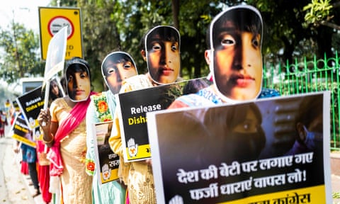 Indian Youth Congress activists wearing masks in support of Disha Ravi in New Delhi last month. 