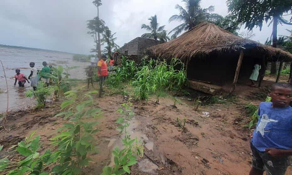People in Mocuba, Mozambique, watch as water levels rise in Licungo River after Ana made landfall.