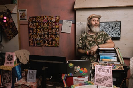 A man poses for a portrait inside