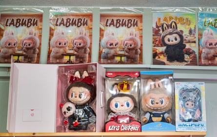 colorfully packaged boxes of cute fluffy demon figurines on a shelf