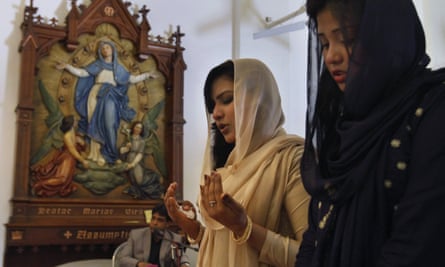 Christian women pray during a mass at St Joseph Cathedral in Rawalpindi on Easter Sunday.