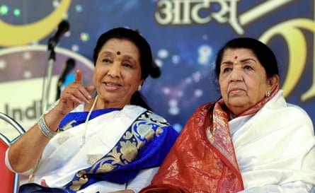 Bhosle, left, with her sister, Lata Mangeshkar, another iconic Bollywood and playback singer, at the Pandit Hridaynath Mangeshkar awards in Mumbai, March 2013.