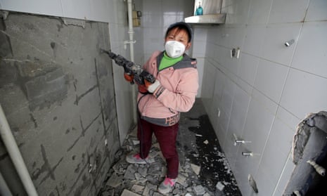 Deng Qiyan, a 47-year-old mother of three, works as a decorator at construction sites in Beijing, the Chinese capital