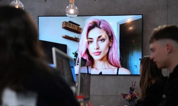 woman with pink hair on a screen