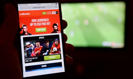A smartphone user accesses the Ladbrokes gambling website