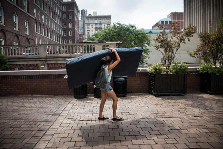 Emma Sulkowicz, a senior visual arts student at Columbia University, carries a mattress in protest of the university’s lack of action after she reported being raped during her sophomore year on September 5, 2014 in New York City