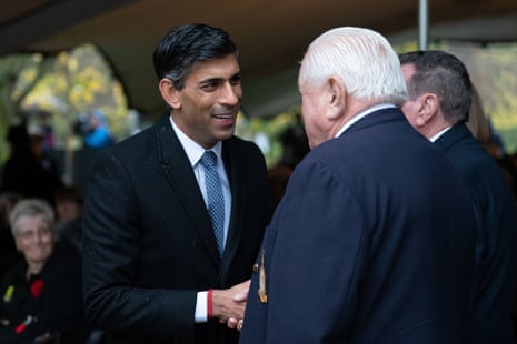 Rishi Sunak talking to atom bomb test veterans Ed McGrath and Eric Barton after announcing that nuclear test veterans will receive a medal recognising their service, during a commemoration event at the National Memorial Arboretum in Alrewas, Staffordshire.