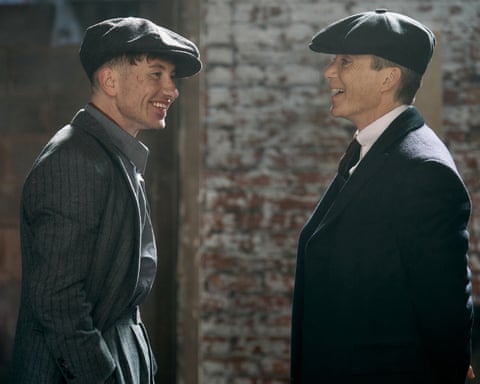 Barry Keoghan and Cillian Murphy in suits and flat caps