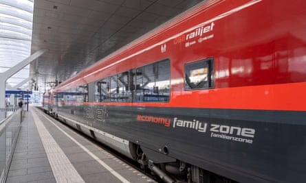 The red and black color OBB Railjet train at Salzburg station.