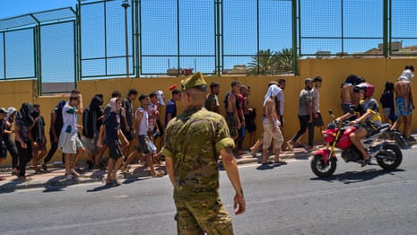 Migrants in Spain's Ceuta enclave escorted back to Morocco – video