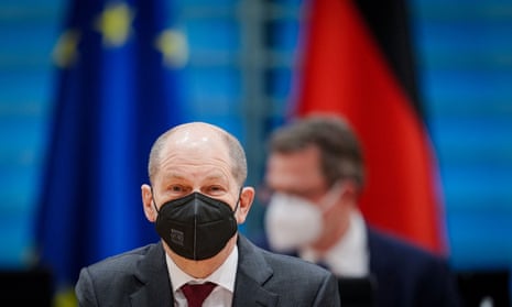 German Chancellor Olaf Scholz wears a protective face mask as he attends the weekly cabinet meeting at the Chancellery in Berlin, Germany, on 16 February.