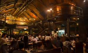 Sapporo Beer Museum interior with tables and tanks