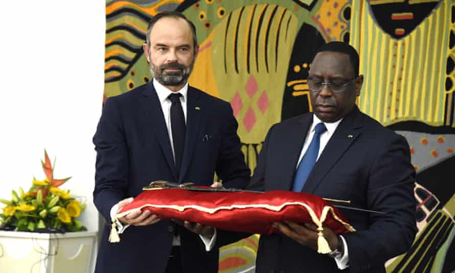 Senegal’s president Macky Sall receiving the sword of Omar Saidou Tall from the French prime minister Edouard Philippe, Dakar, November 2019.