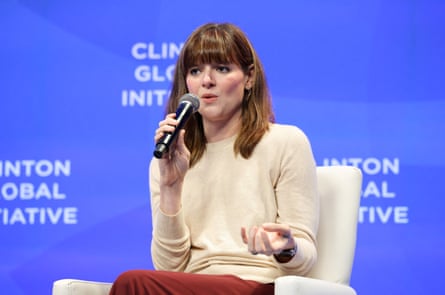 a woman speaks into a microphone