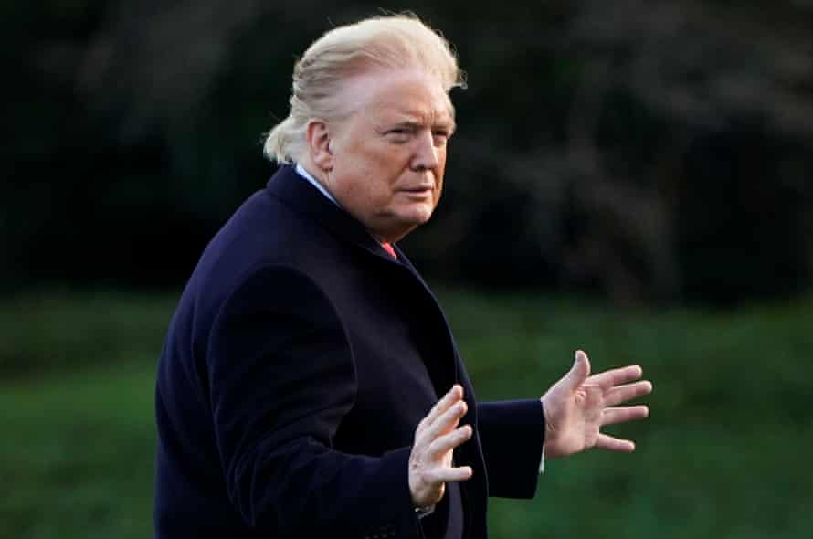 Donald Trump walks across the South Lawn as he returns from North Carolina on February 7, 2020.