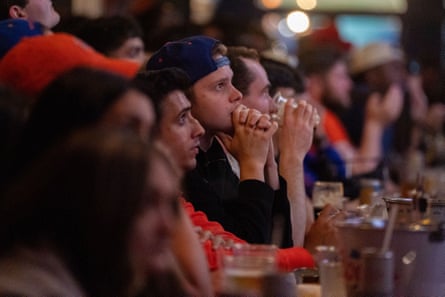 people sitting connected a barroom