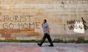 Messagesagainst tourism in Oviedo, northern Spain.