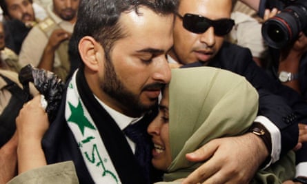 Muntazer al-Zaidi embraces his sister following his release from prison in Baghdad in 2009.
