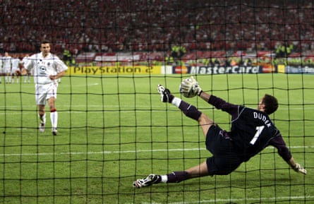 Jerzy Dudek keeps out Andriy Shevchenko’s penalty in the shootout, having earlier pulled off a miracle double save from him in extra time.