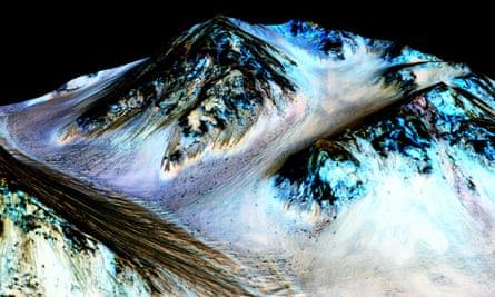 dark streaks on the surface of mars in a photo from Nasa's Reconnaisance orbiter