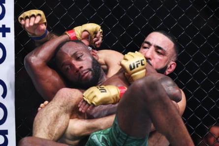 Belal Muhammad works for a submission against Leon Edwards.